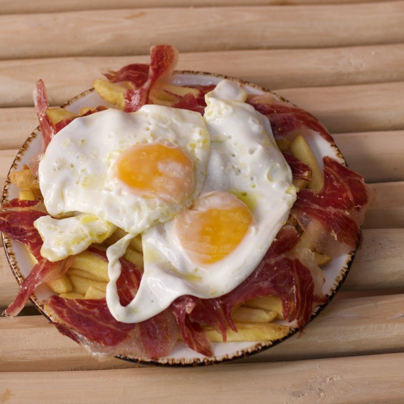Huevos rotos with Iberian ham — Casa 26, Marbella